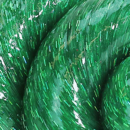 Close up texture of green glitter putty.